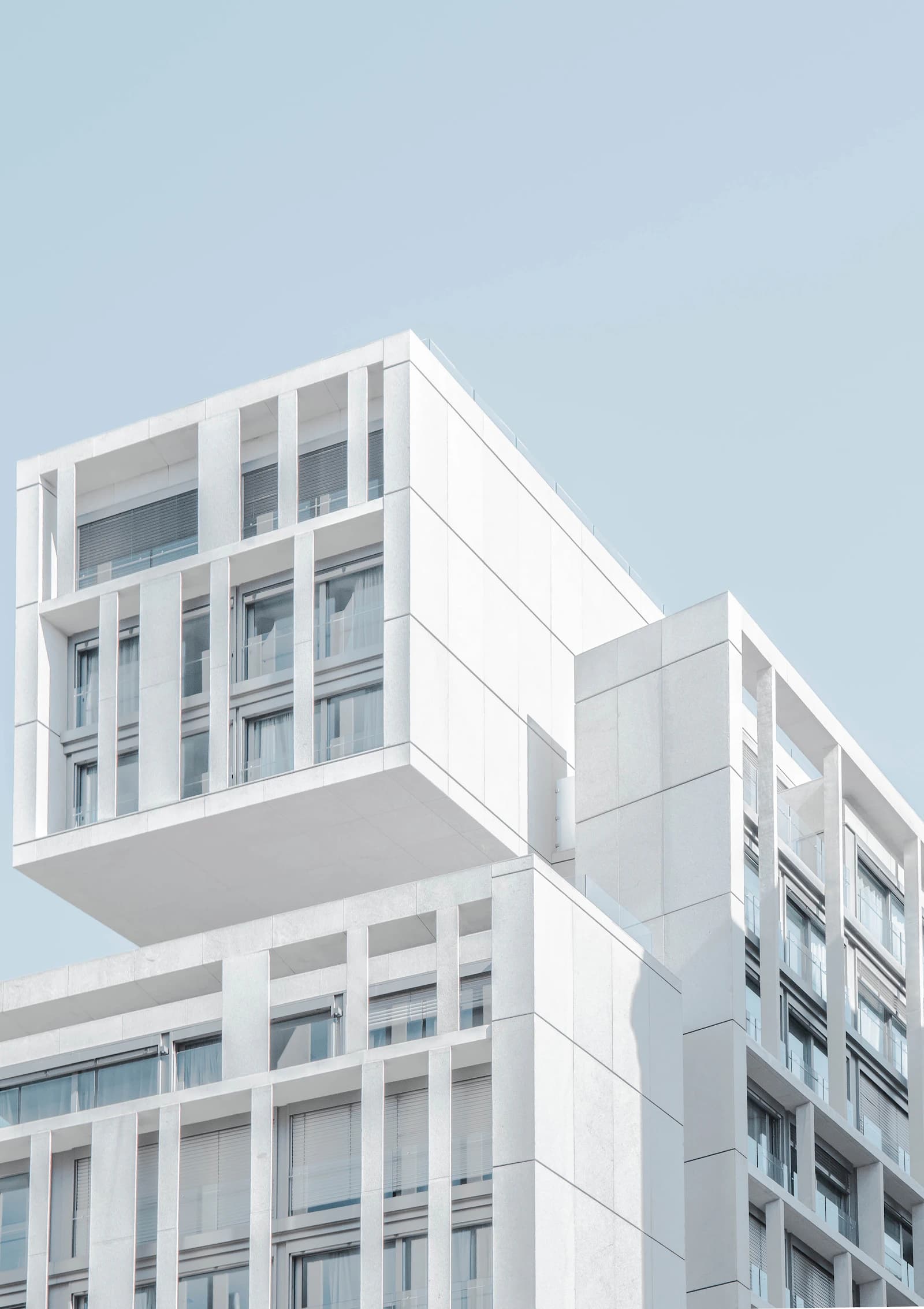 Sculptural white architectural forms against a clear sky